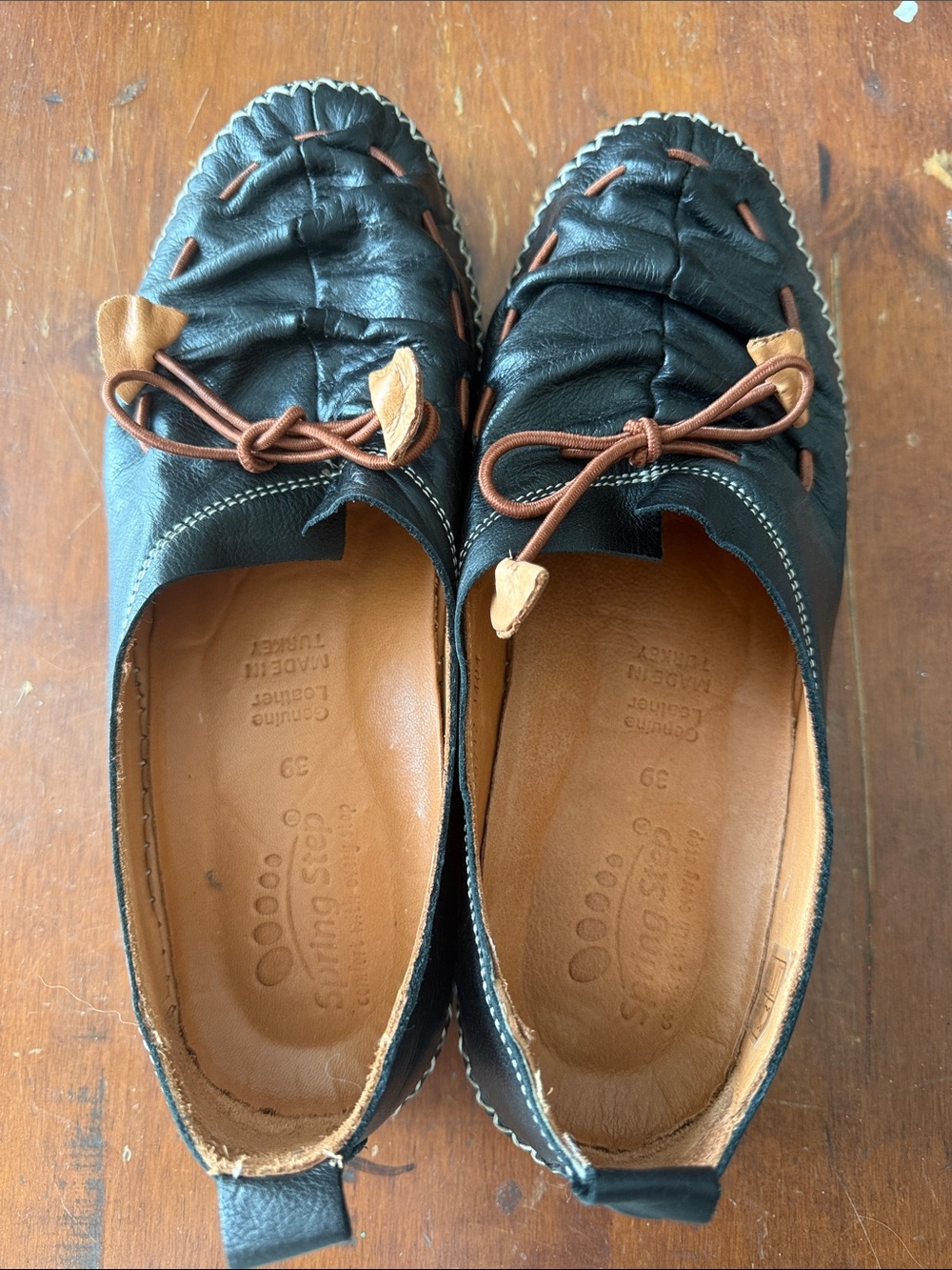 Spring Step Black Leather Slip-On Moccasin Flats with Brown Accents